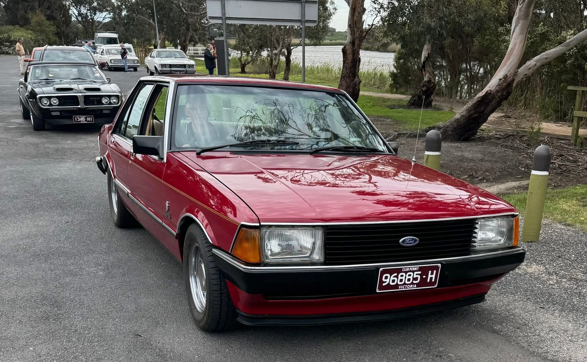 Ford Falcon red sedan club run